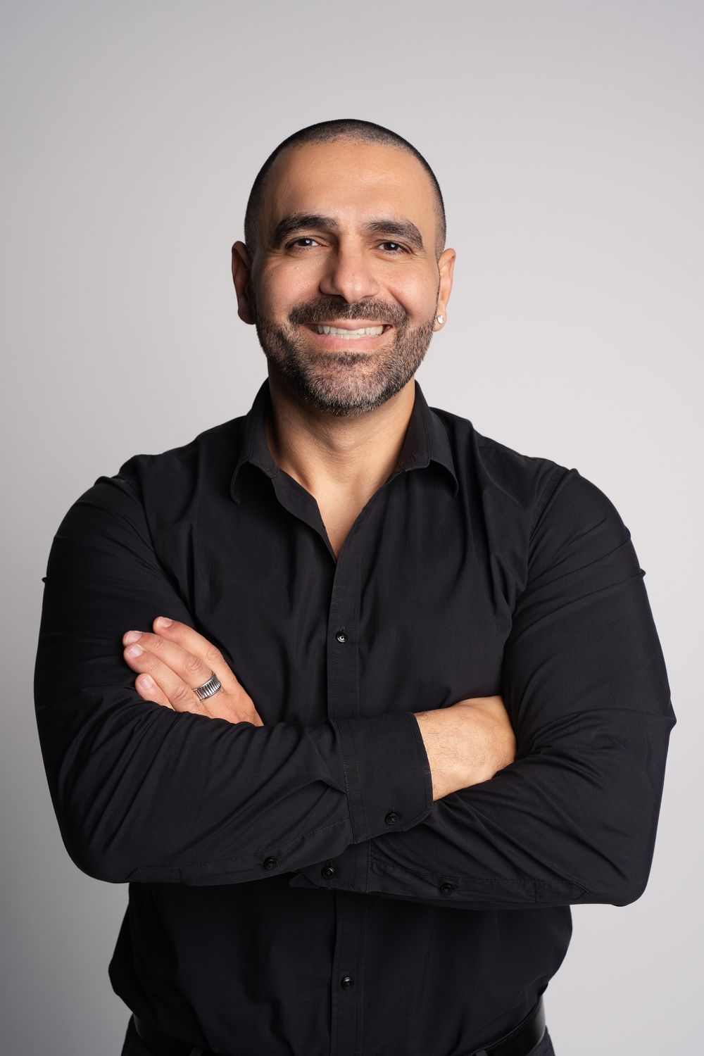 Peter Ishak, founder of Ishaks, arms crossed